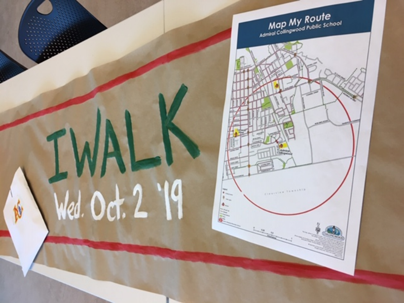 Image of an i walk event sign with a Map My Route document Image of an i walk event sign with a Map My Route document