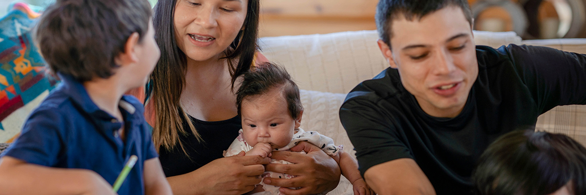 Young family with newborn and 2 children